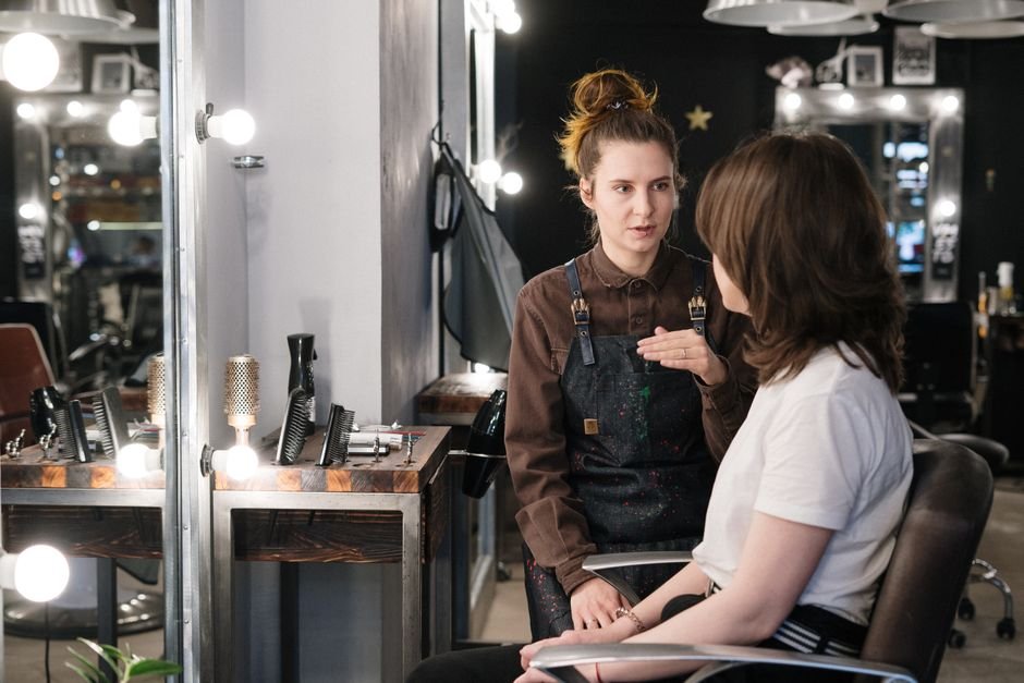 Stylist consulting with a salon guest